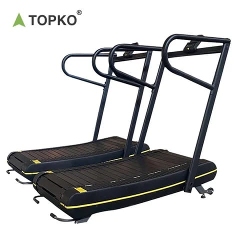 Tapis de course incurvé manuel, vue de profil