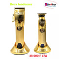 Duo de tondeuses Kemei dorées sur leurs socles de charge